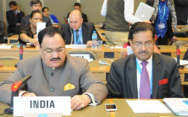 Jagat Prakash Nadda seated behind a desk nameplate reading India at an international assembly