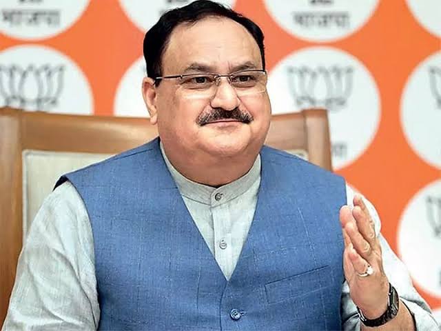 Jagat Prakash Nadda seated and speaking, wearing a blue sleeveless jacket