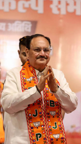 Jagat Prakash Nadda with hands folded in greeting, wearing a patterned stole